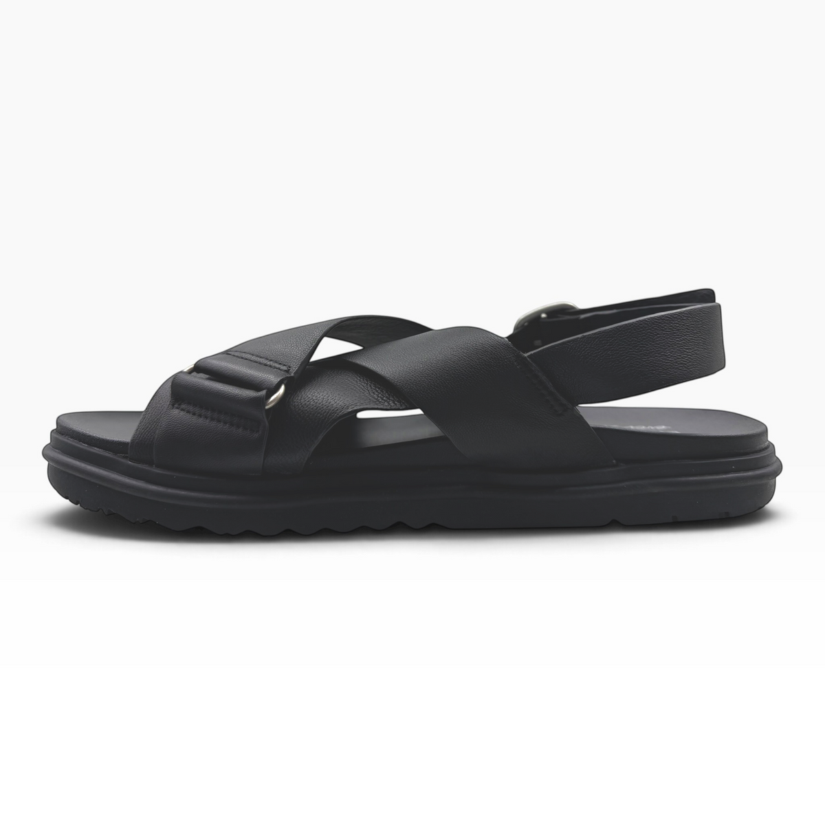 The Shoe Shop Faye sandal in espresso leather with crossed straps, adjustable heel buckle, and ridged rubber sole.