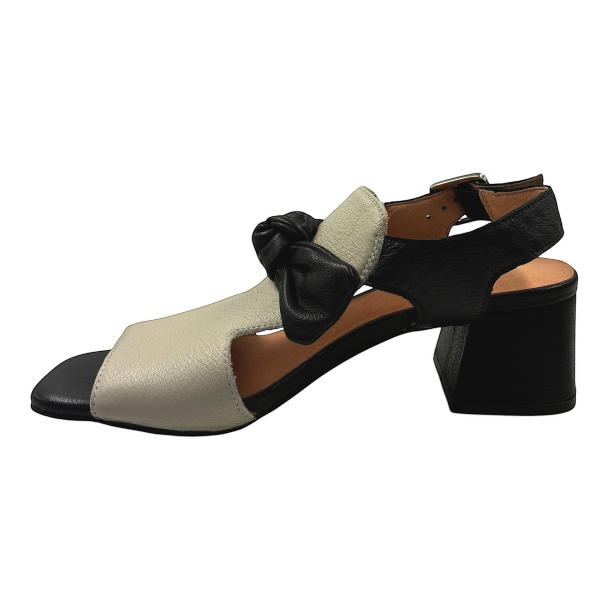 The Shoe Shop Felia leather block heel sandal in black and cream with a decorative bow and adjustable ankle strap.