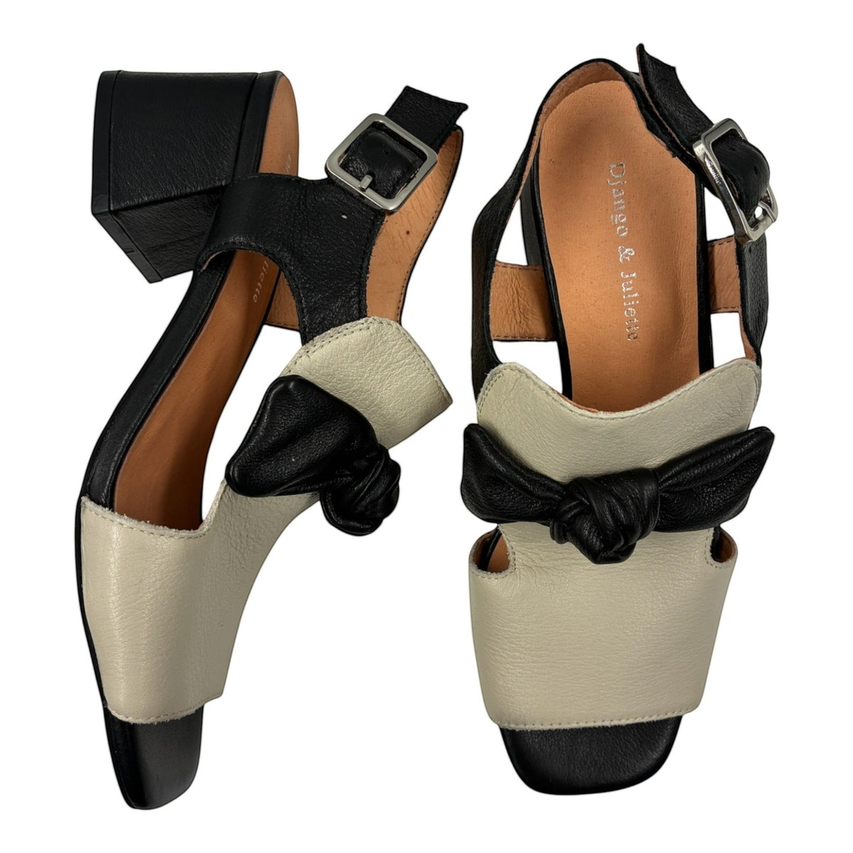 The Shoe Shop Felia leather sandals in black and cream with a block heel, bow detail, and adjustable ankle strap.
