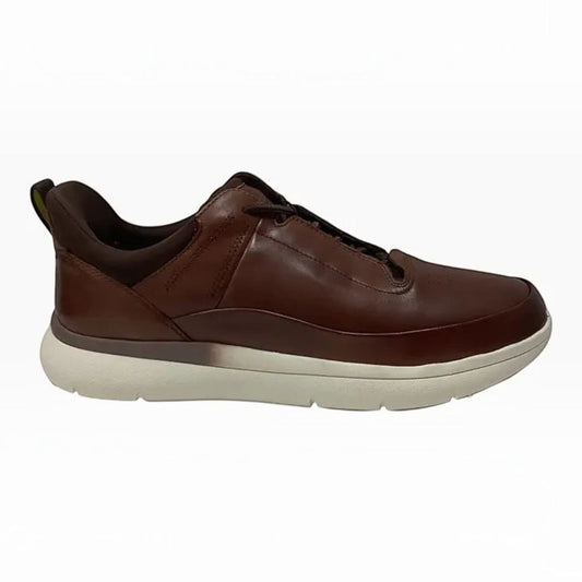The Shoe Shop Florsheim Fortress brown leather low-top sneaker with a white cushioned sole and padded collar.