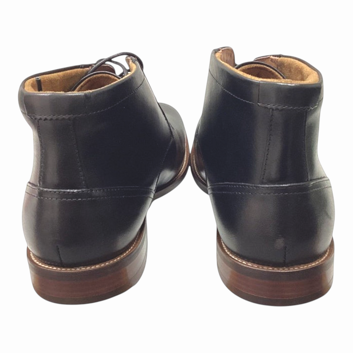 The Shoe Shop Florsheim Rucci black leather chukka boots showing the back view with a stacked heel and stitched welt.