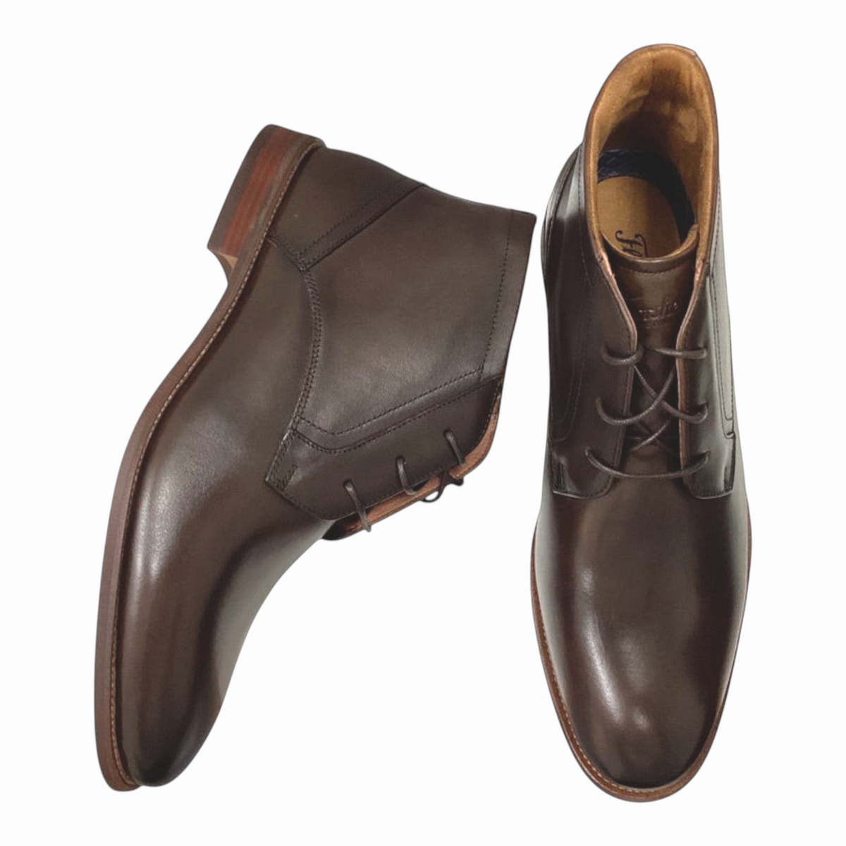 The Shoe Shop Florsheim Rucci dark brown leather chukka boots with three-eyelet lace-up and stacked-look sole.