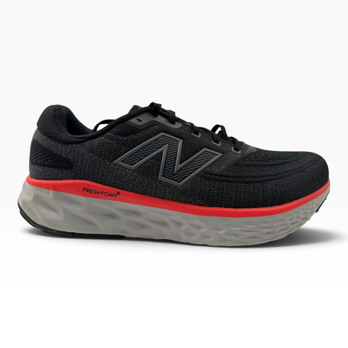 The Shoe Shop Fresh Foam X EVOZ V4 running shoe in black with a red midsole stripe and grey cushioned sole