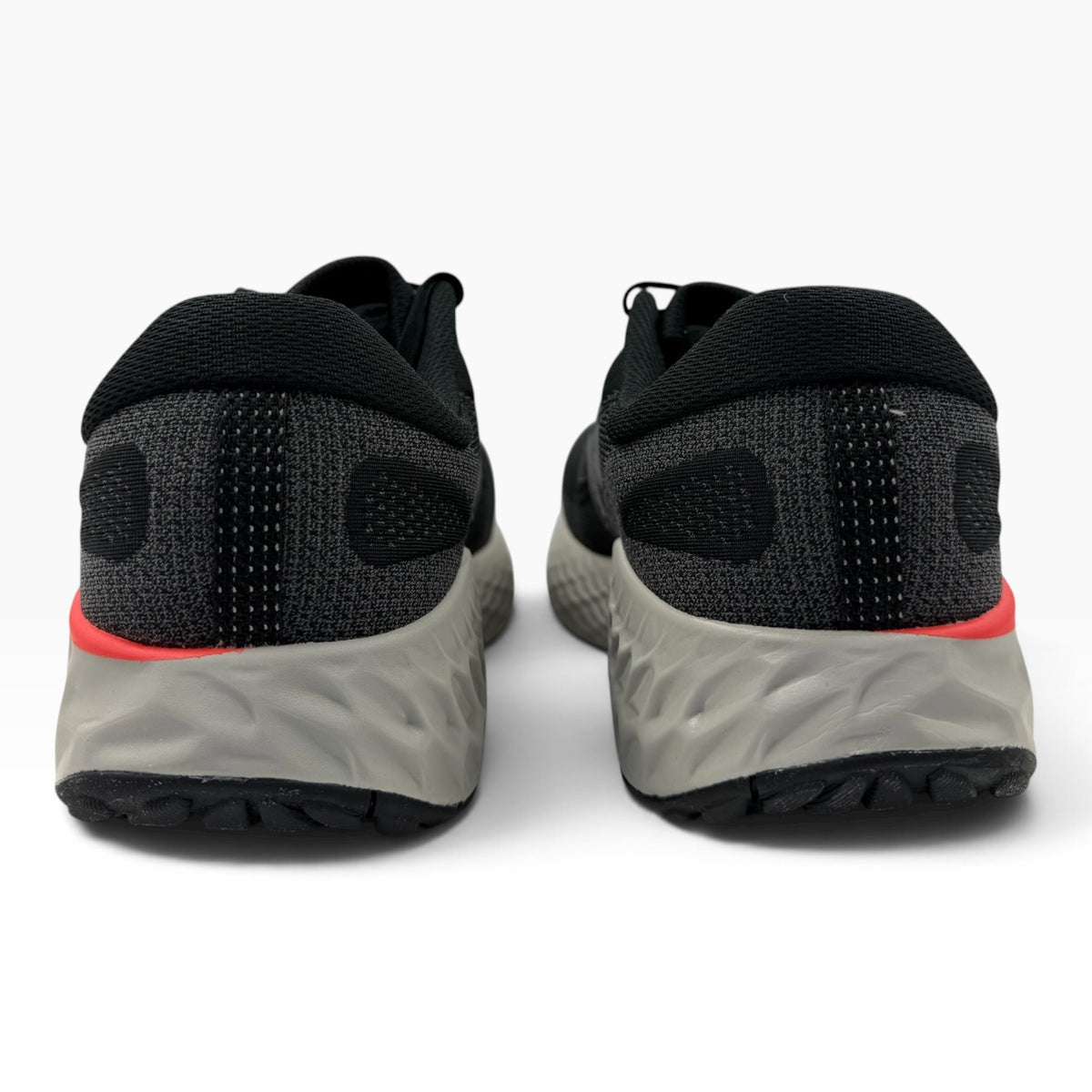 The Shoe Shop Fresh Foam X EVOZ V4 running shoes in black with grey cushioned midsoles and red accent details.