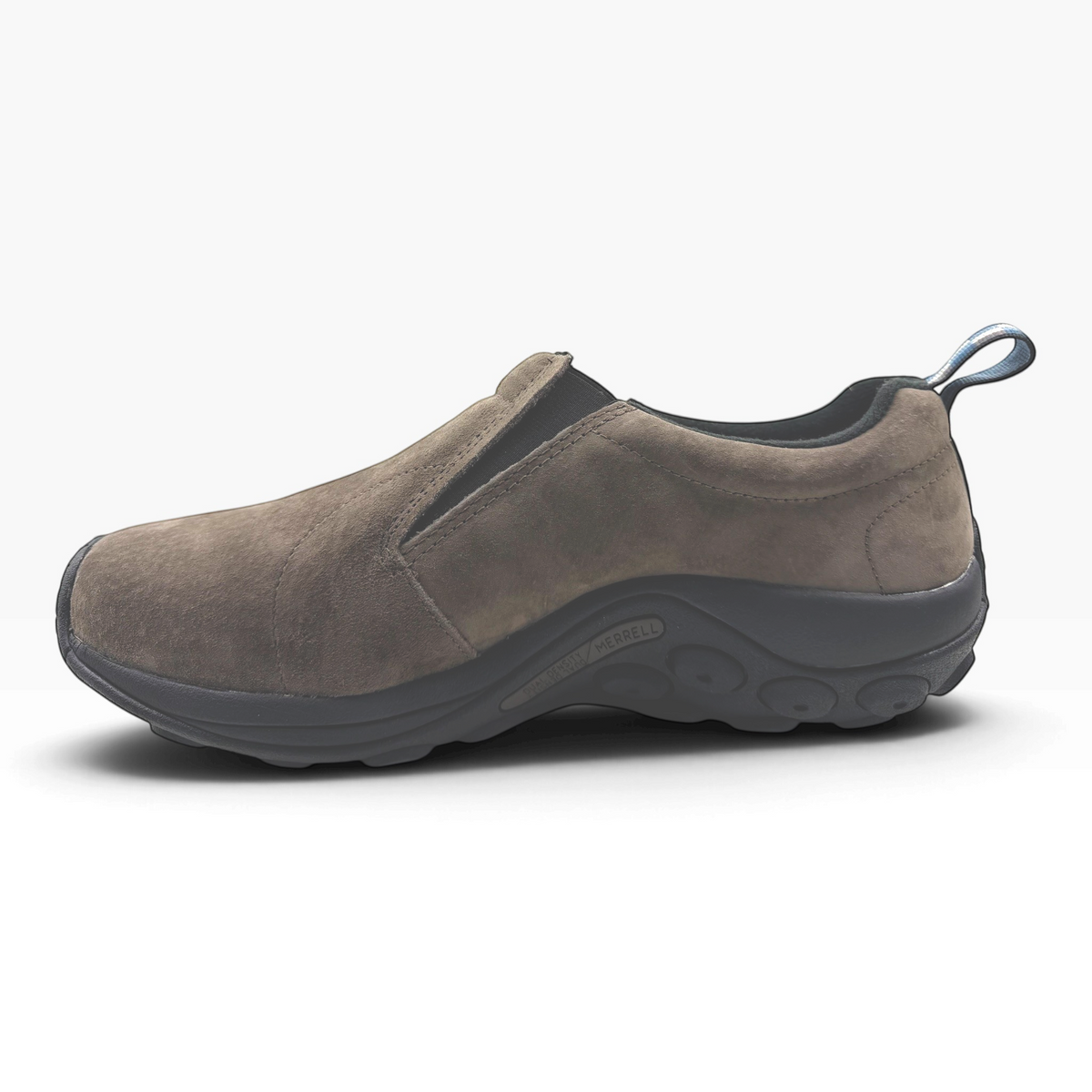 The Shoe Shop Jungle Moc in fudge brown suede with a black rubber sole and pull tab, side view.