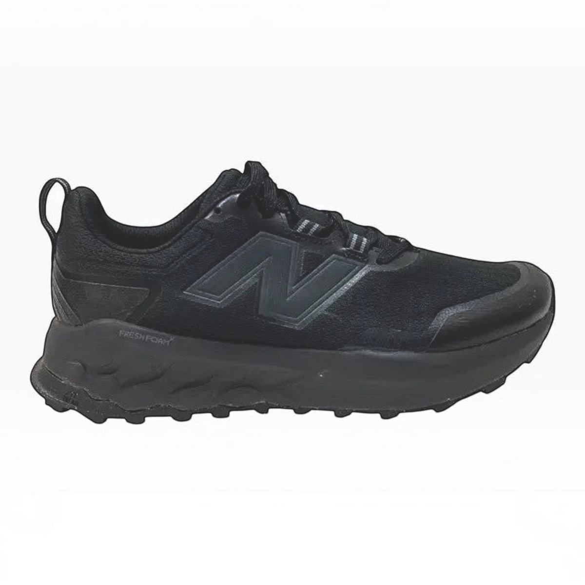 The Shoe Shop Garoé V2 all-black trail running shoe with breathable mesh upper and Fresh Foam midsole for cushioning.