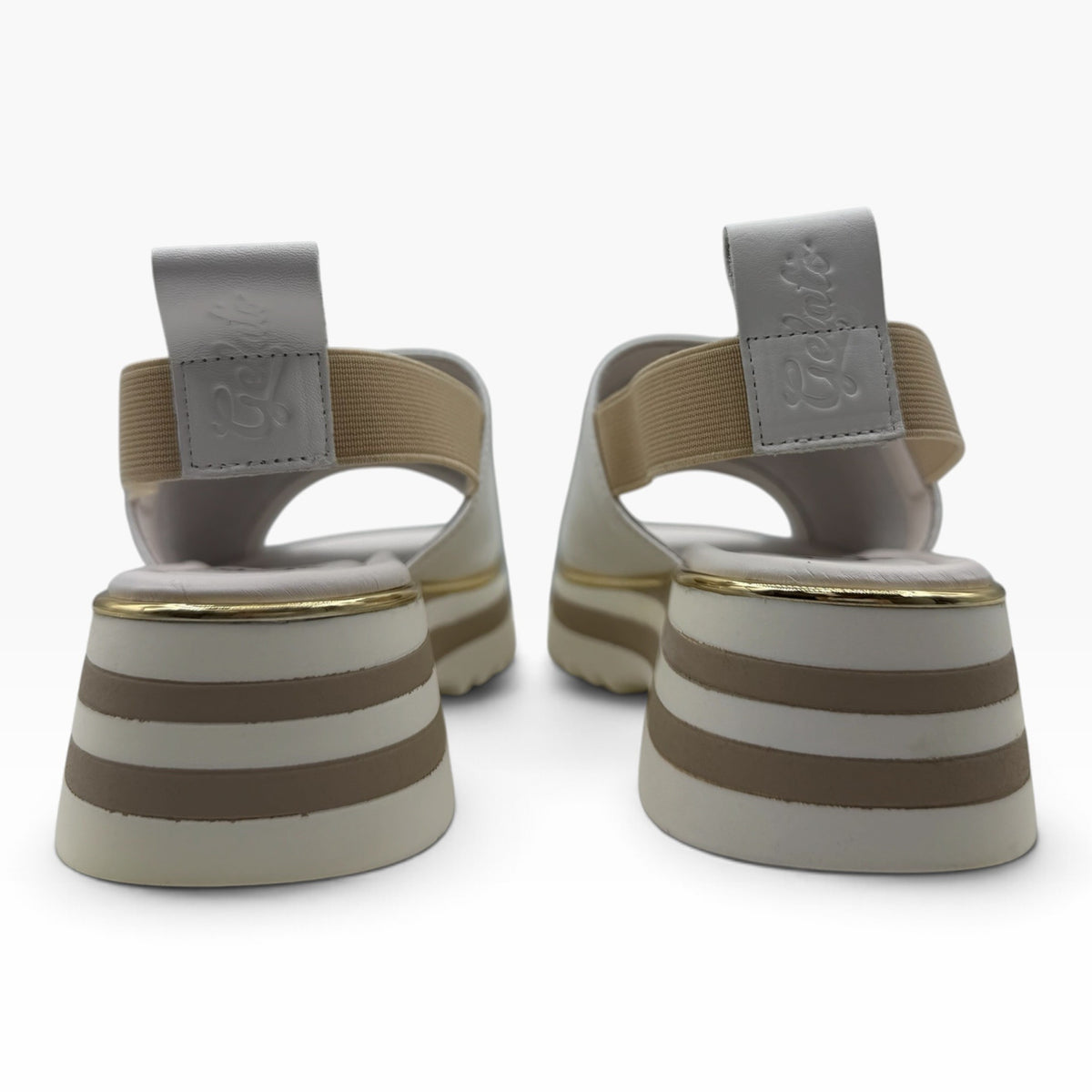 The Shoe Shop Gisborne platform sandals in beige leather with elasticated back straps and metallic trim detail.
