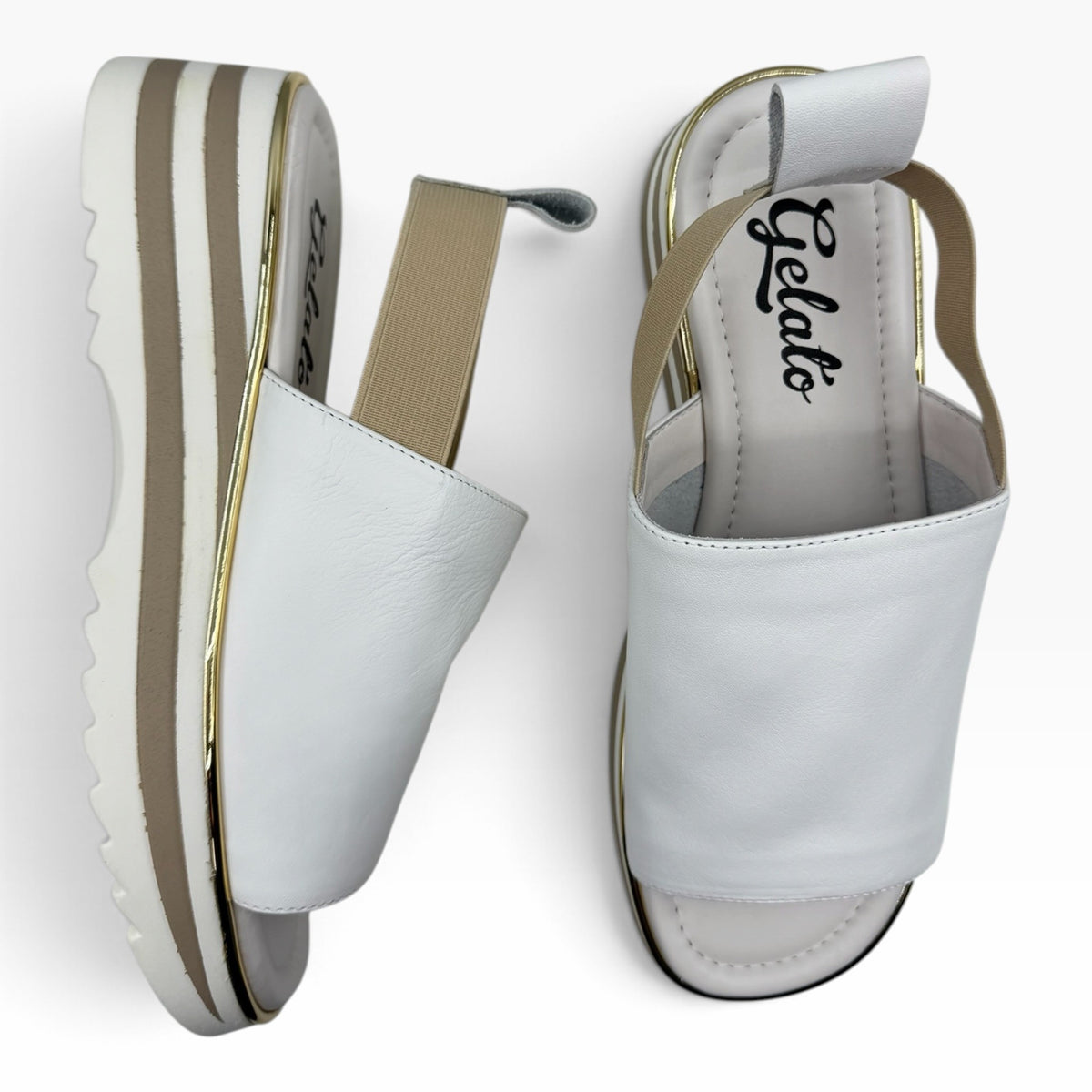 The Shoe Shop Gisborne white leather platform sandals with elasticated back strap and metallic trim detail.