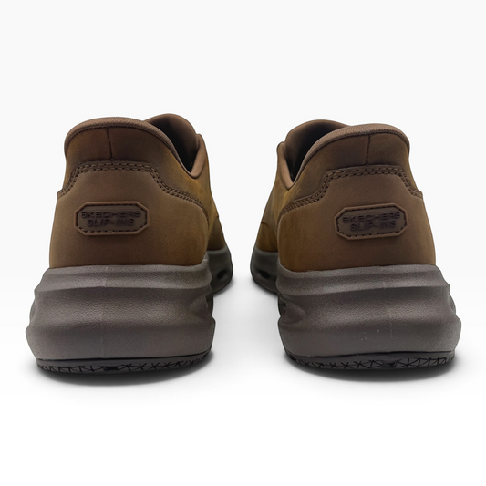 Rear view of The Shoe Shop Glide Step Cade brown slip-on sneakers with cushioned soles and Skechers branding