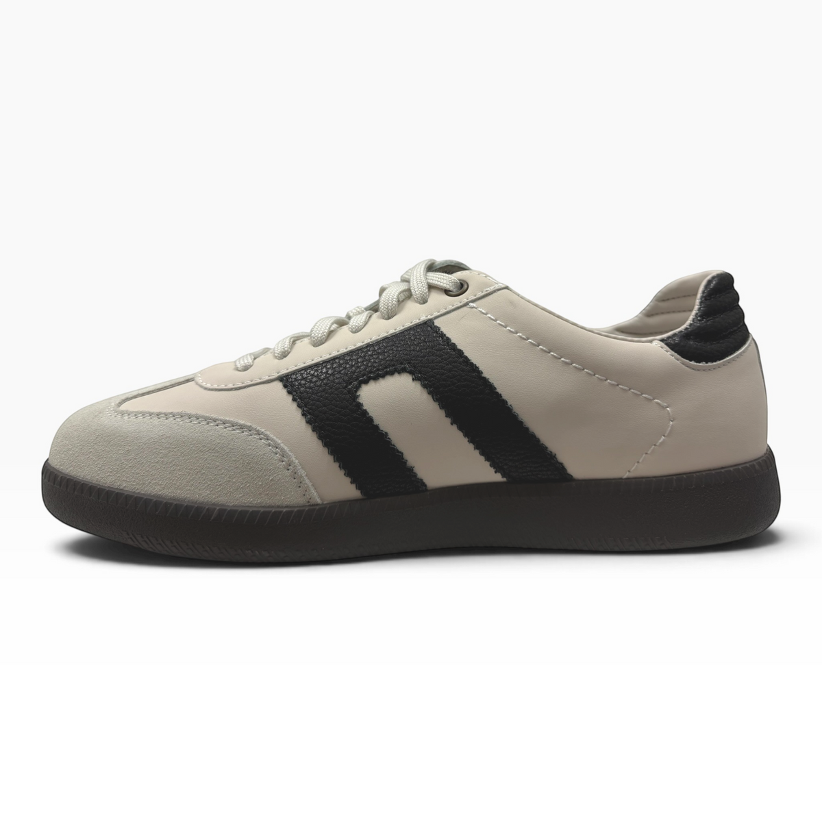 The Shoe Shop Gordon low-top sneaker in beige suede and leather with black side stripes and a gum rubber sole.