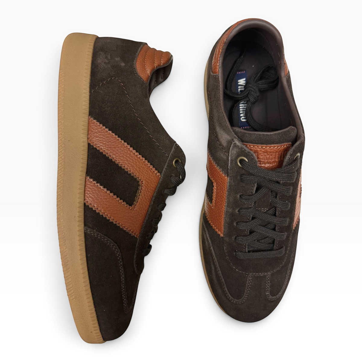 The Shoe Shop Gordon low-top sneakers in dark brown suede with tan leather side stripes and gum rubber soles.