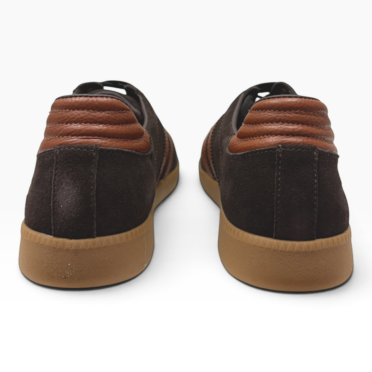The Shoe Shop Gordon low-top sneakers in dark brown suede with tan leather heel detail and gum rubber soles.