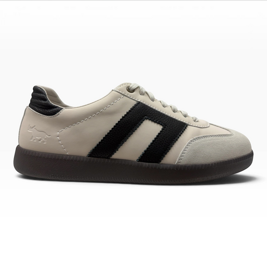 The Shoe Shop Gordon low-top sneaker in beige suede and leather with black side stripes and a dark gum rubber sole.