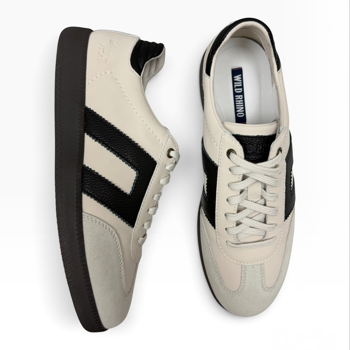 The Shoe Shop Gordon low-top sneakers in cream suede and black leather with gum rubber soles and lace-up fastening.