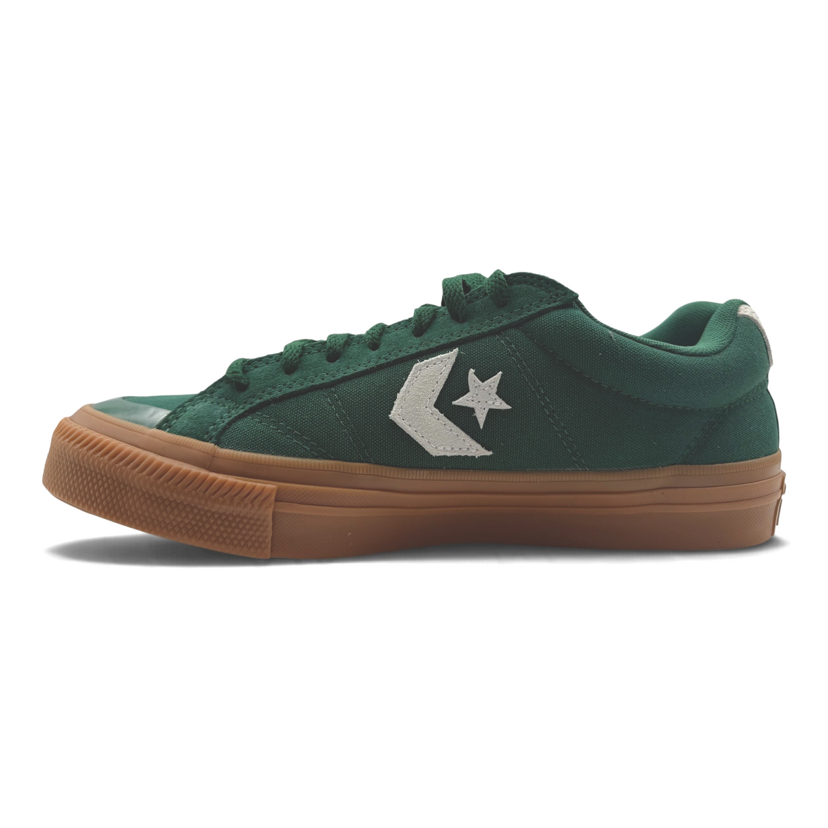The Shoe Shop Converse green canvas low sneaker with a gum rubber outsole and white Star Chevron branding.