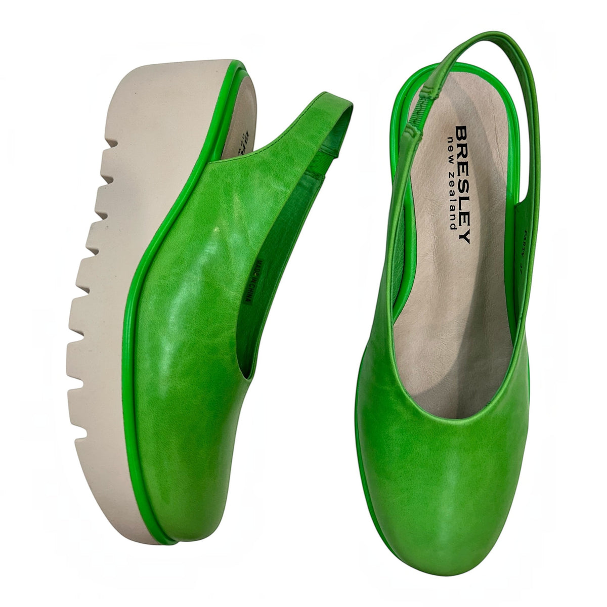 The Shoe Shop Party green leather slingback wedge shoes with a thick beige rubber sole for comfort and stability.