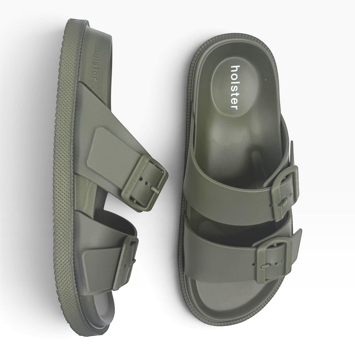 The Shoe Shop Soleseeker green slide sandals with adjustable buckle straps and a supportive cushioned footbed.