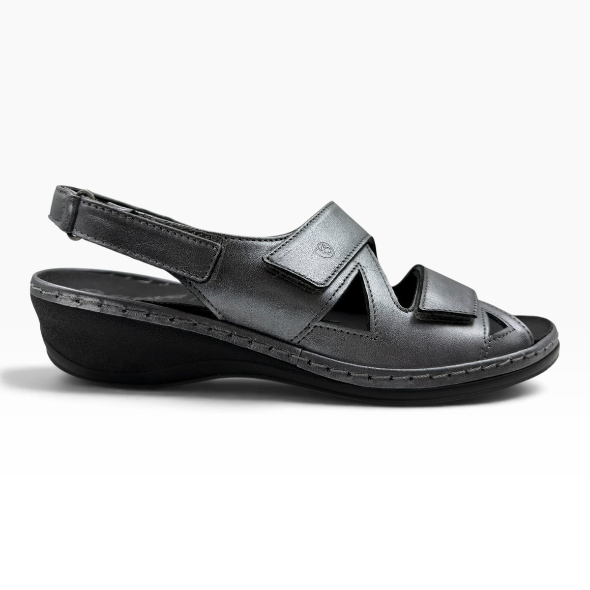 The Shoe Shop Emblin wedge sandal in gunmetal leather with adjustable velcro straps and a cushioned footbed.