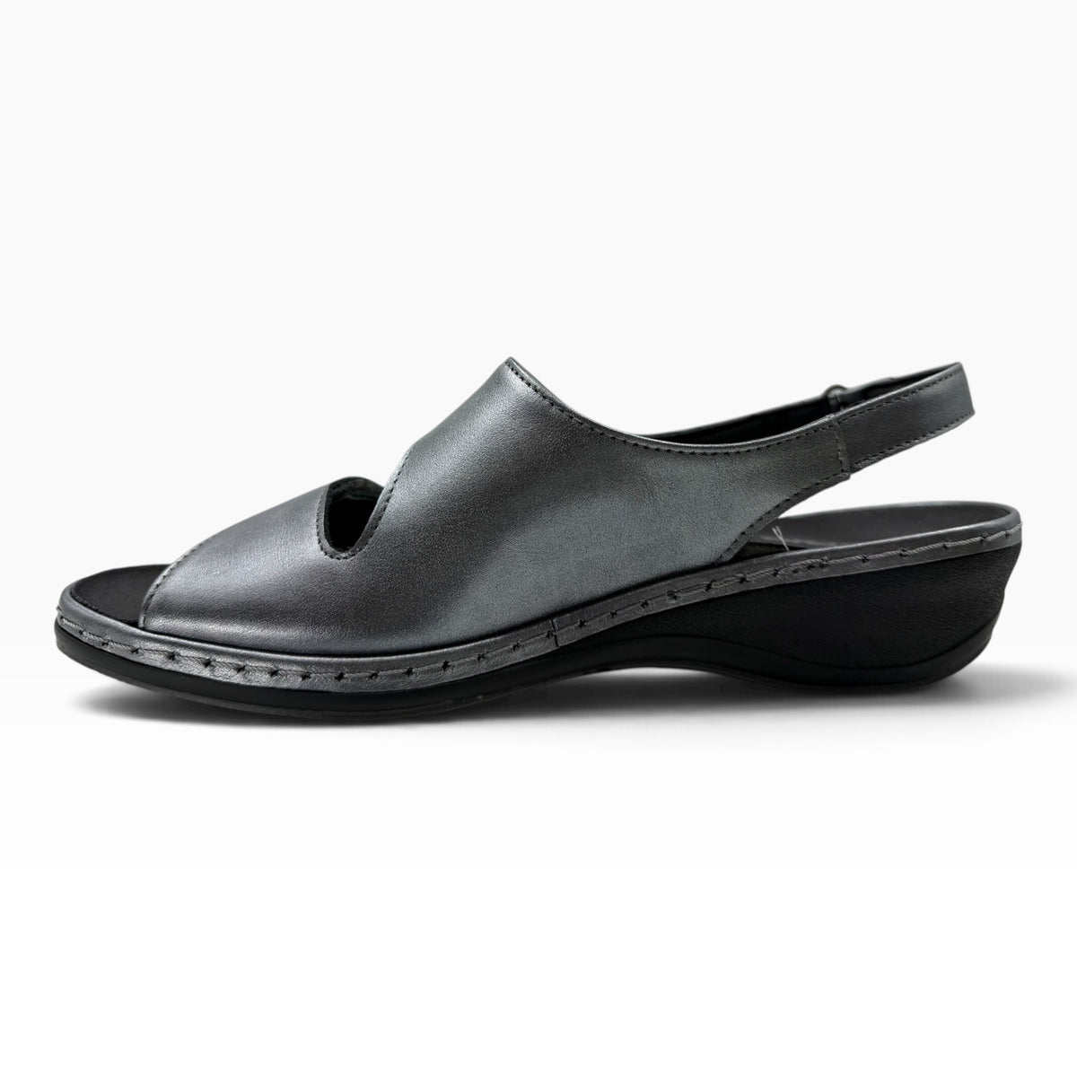 The Shoe Shop Emblin wedge sandal in gunmetal leather with a slingback strap and low cushioned heel.