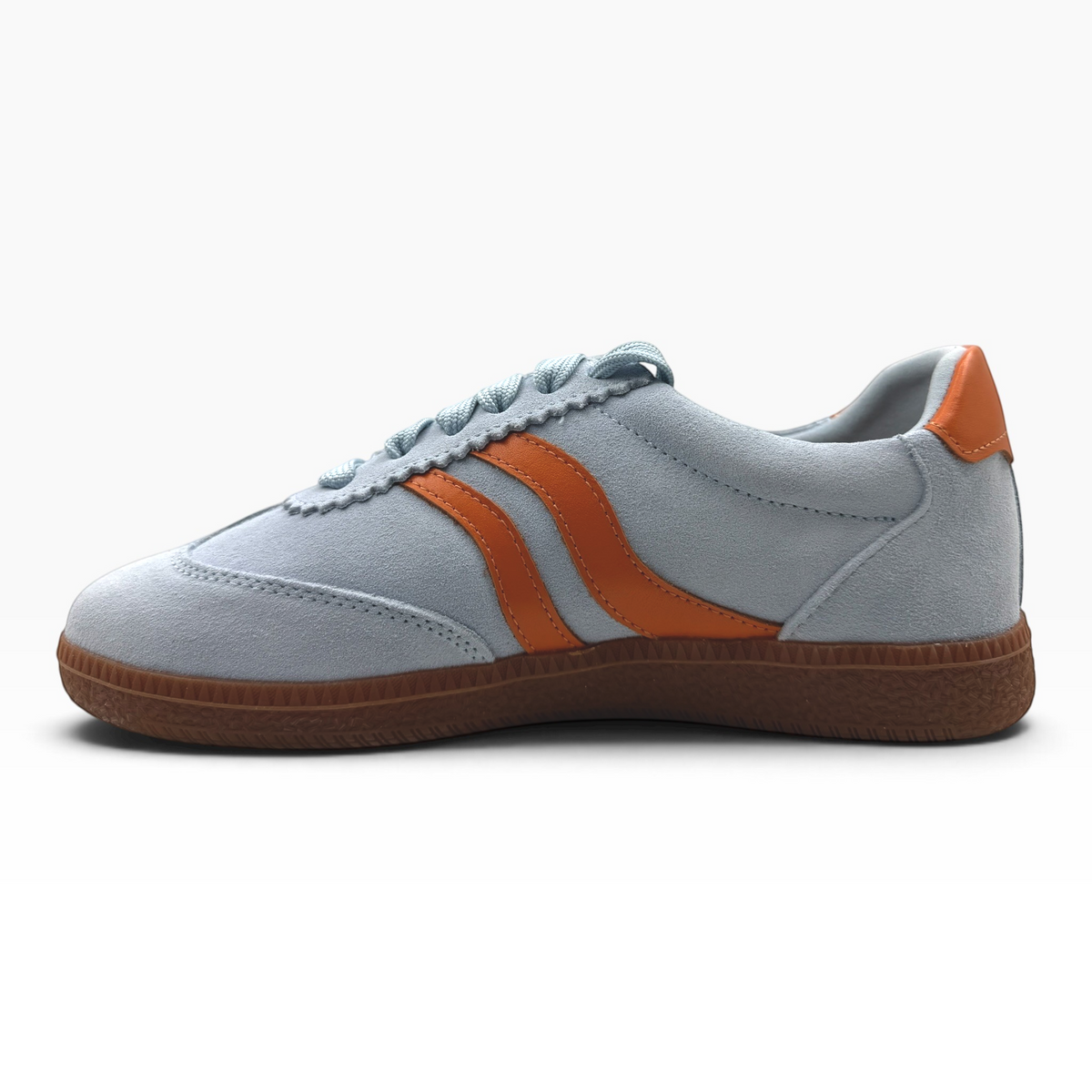 The Shoe Shop Hamptons light blue suede sneaker with tan leather side stripes and a textured gum rubber sole.