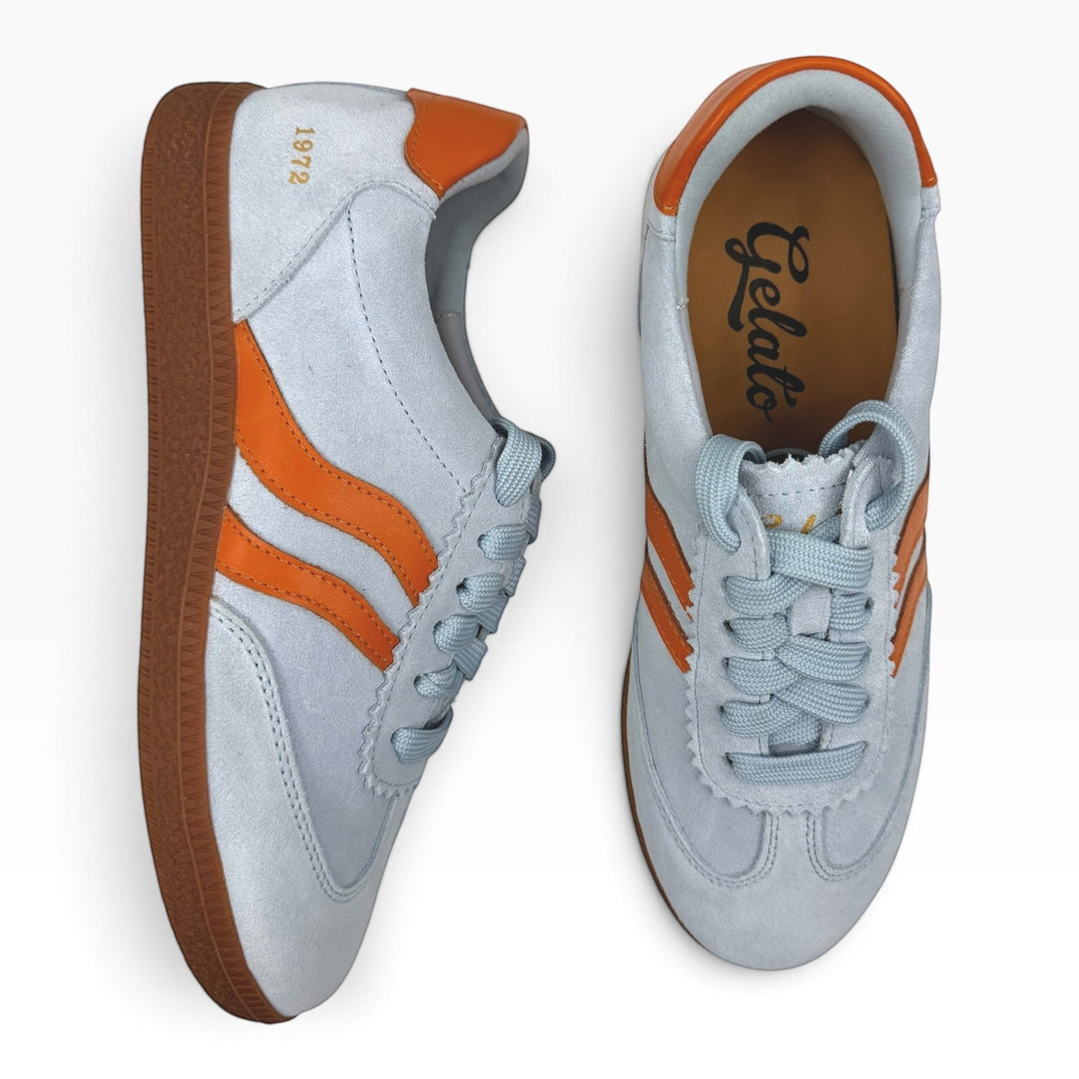 The Shoe Shop Hamptons sneakers in light grey suede with orange leather accents and a classic gum rubber sole.