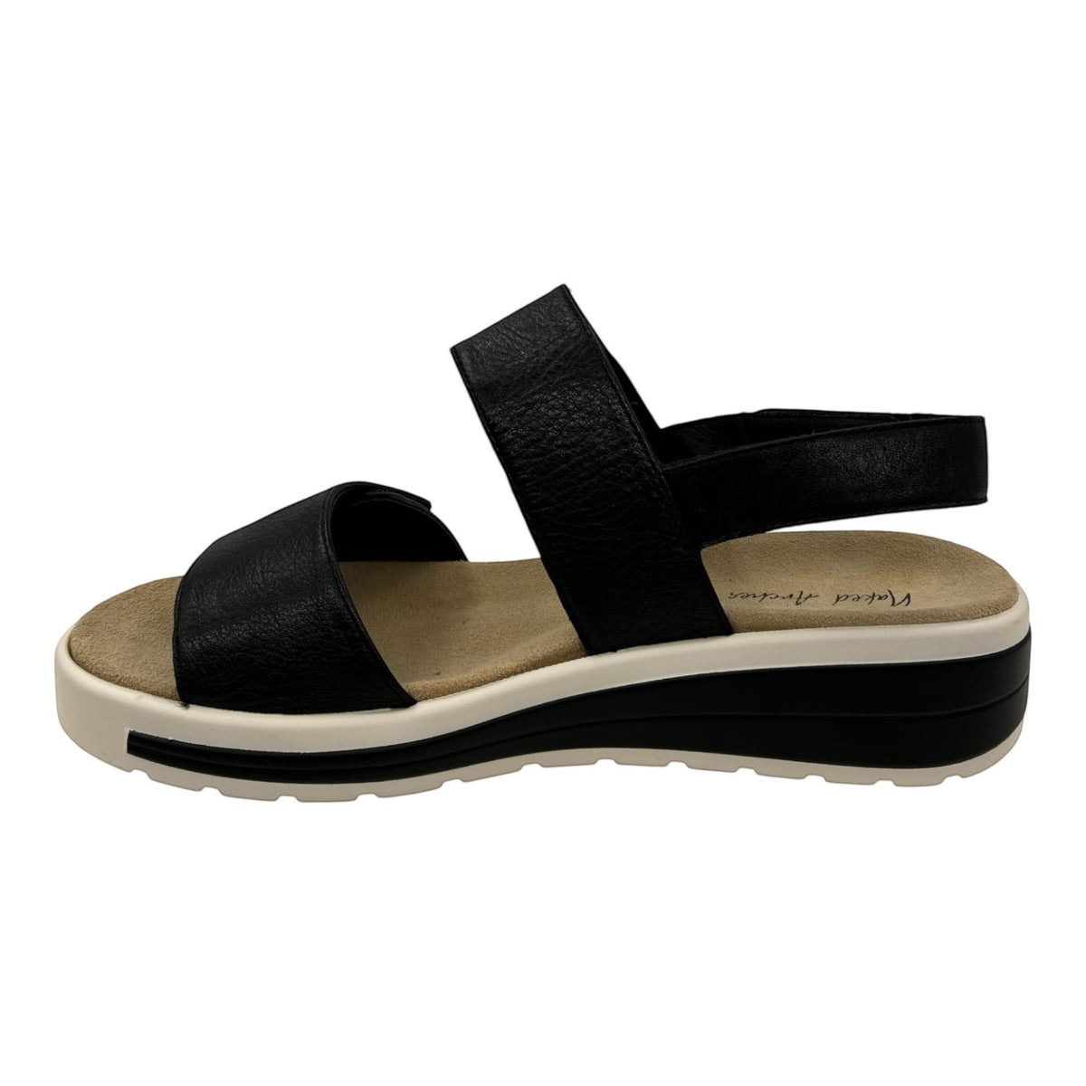The Shoe Shop Hanza black leather slingback sandal with adjustable straps, cushioned footbed, and supportive wedge sole.