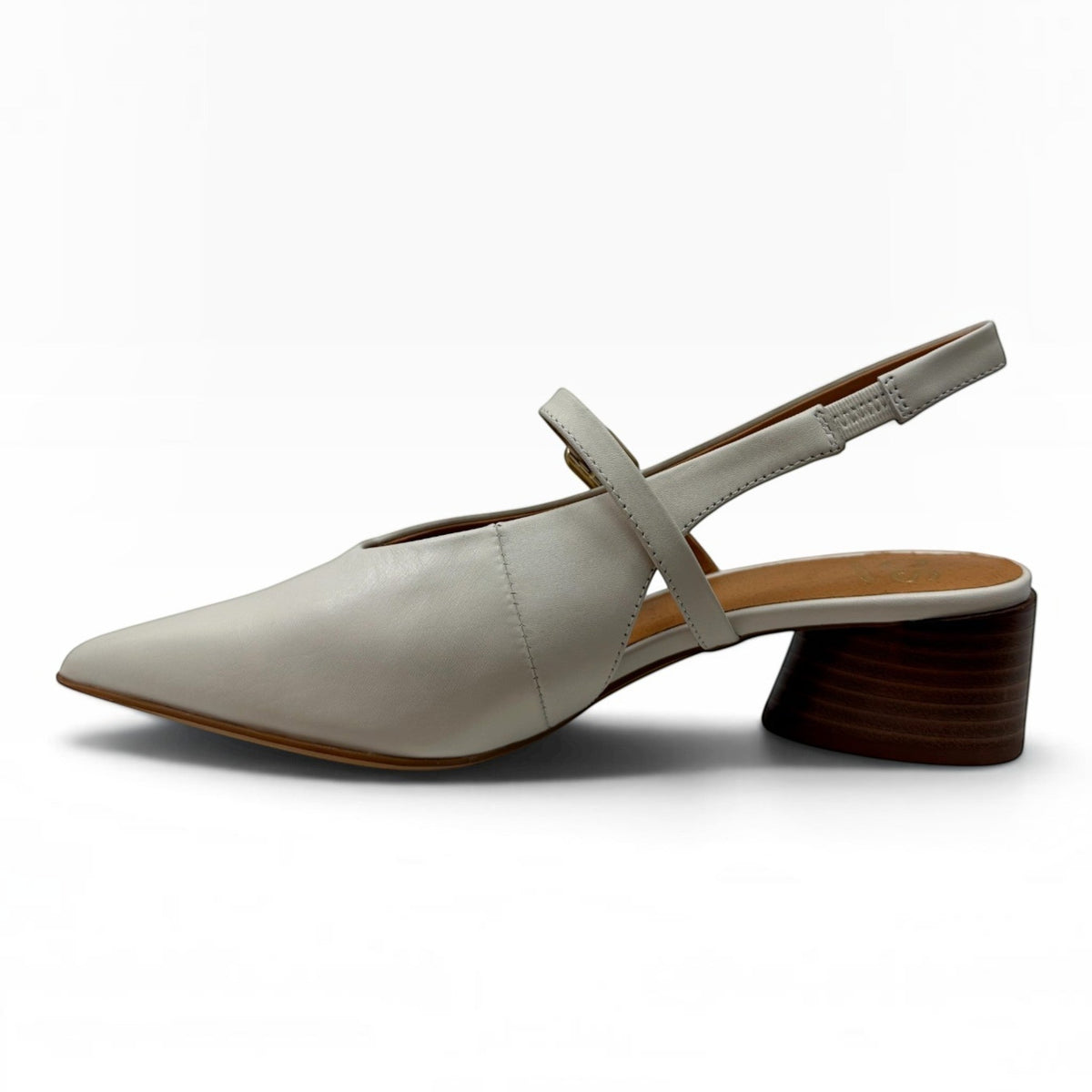 The Shoe Shop Hattis Heel in cream leather with a pointed toe, adjustable slingback strap, and low wooden block heel.