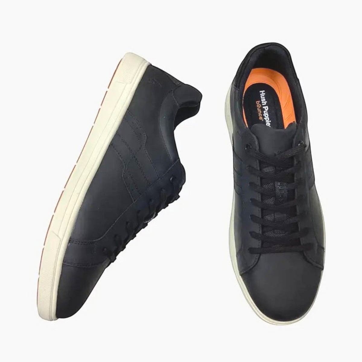 The Shoe Shop Hush Puppies Gravity black leather sneakers with white rubber soles and cushioned Bounce footbeds.