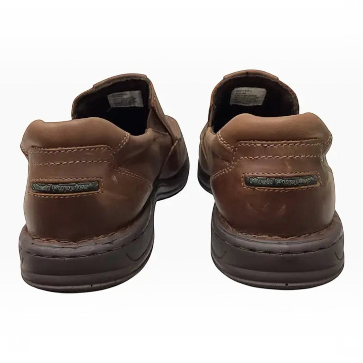 The Shoe Shop Hush Puppies Sawyer II brown leather boat-style walkers showing heel detail and branding