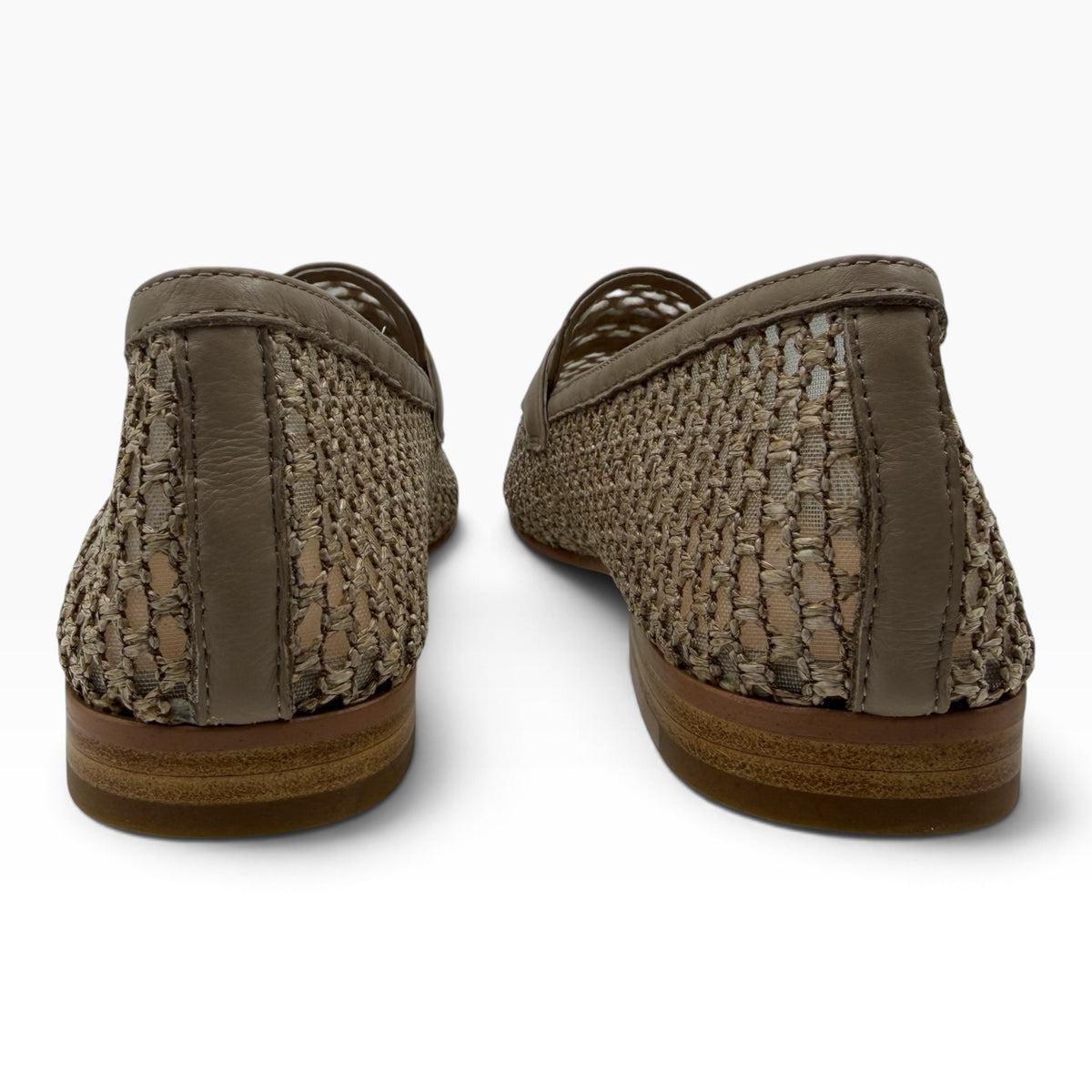 The Shoe Shop Irasy loafers in beige featuring a woven leather texture and a low stacked heel, rear view.
