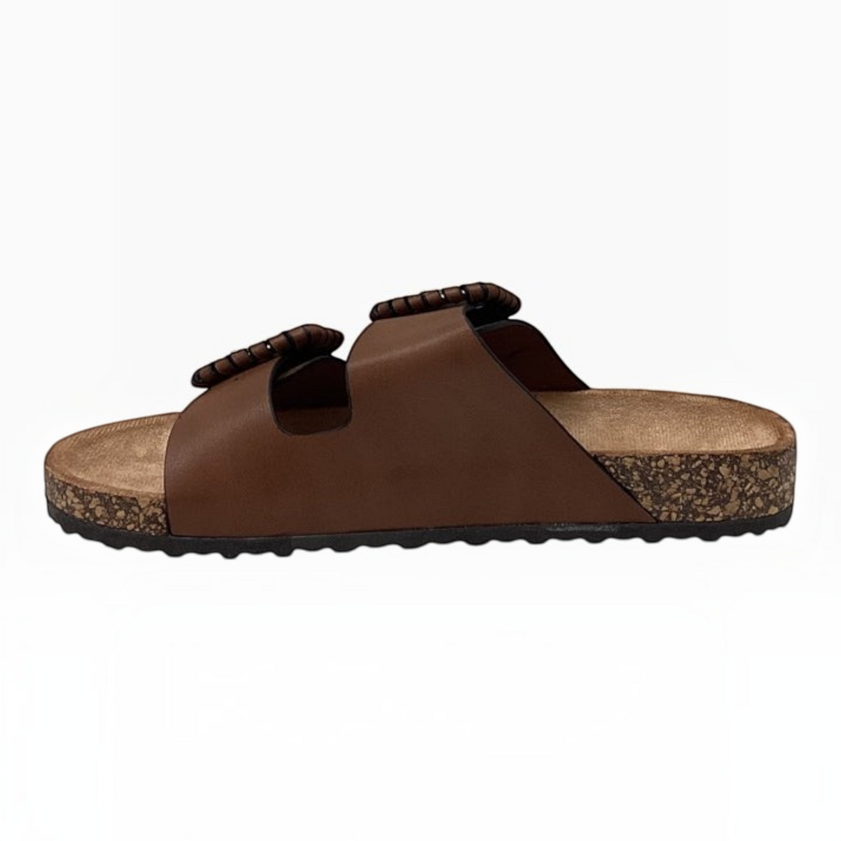 The Shoe Shop Jirona slide in brown leather with two adjustable straps, statement buckles, and a cork footbed.