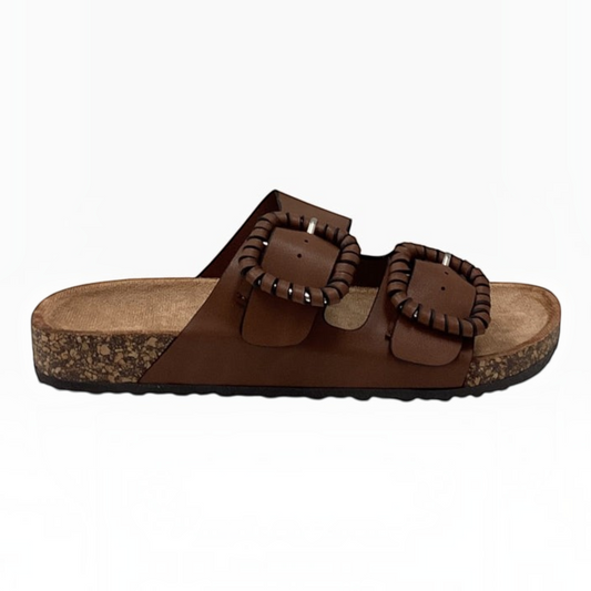The Shoe Shop Jirona brown leather slide sandals with two adjustable straps, statement buckles, and cork footbed.
