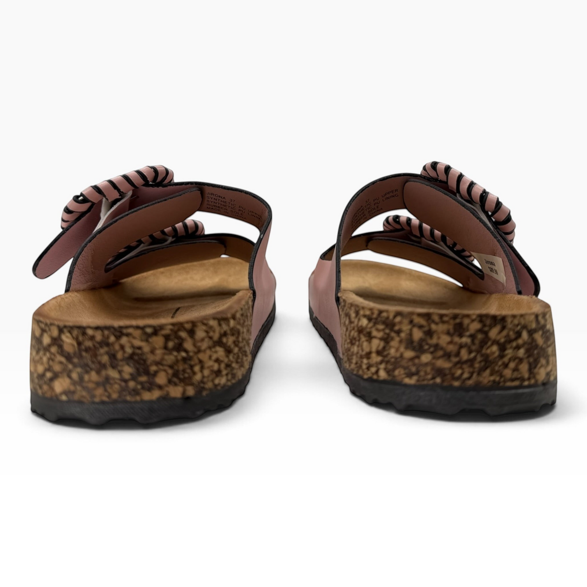 The Shoe Shop Jirona slide in pink leather with adjustable straps, statement buckles, and a natural cork footbed.