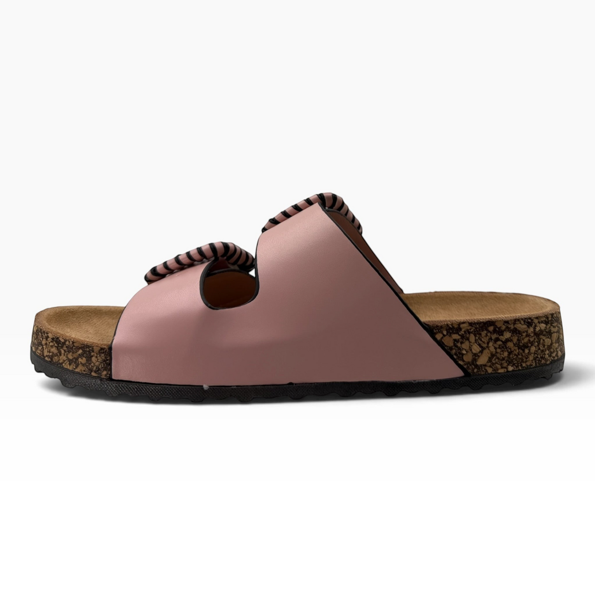 The Shoe Shop Jirona slide in dusty pink leather with two adjustable straps, statement buckles, and cork footbed.