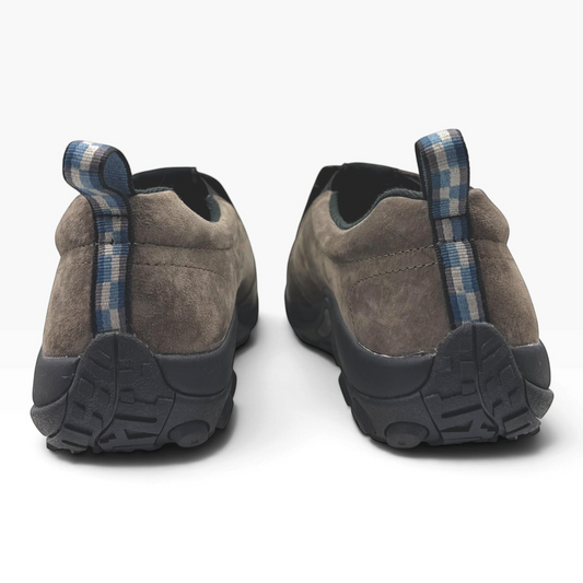 The Shoe Shop Jungle Moc in fudge brown suede with a blue checkered heel pull tab, viewed from the back.