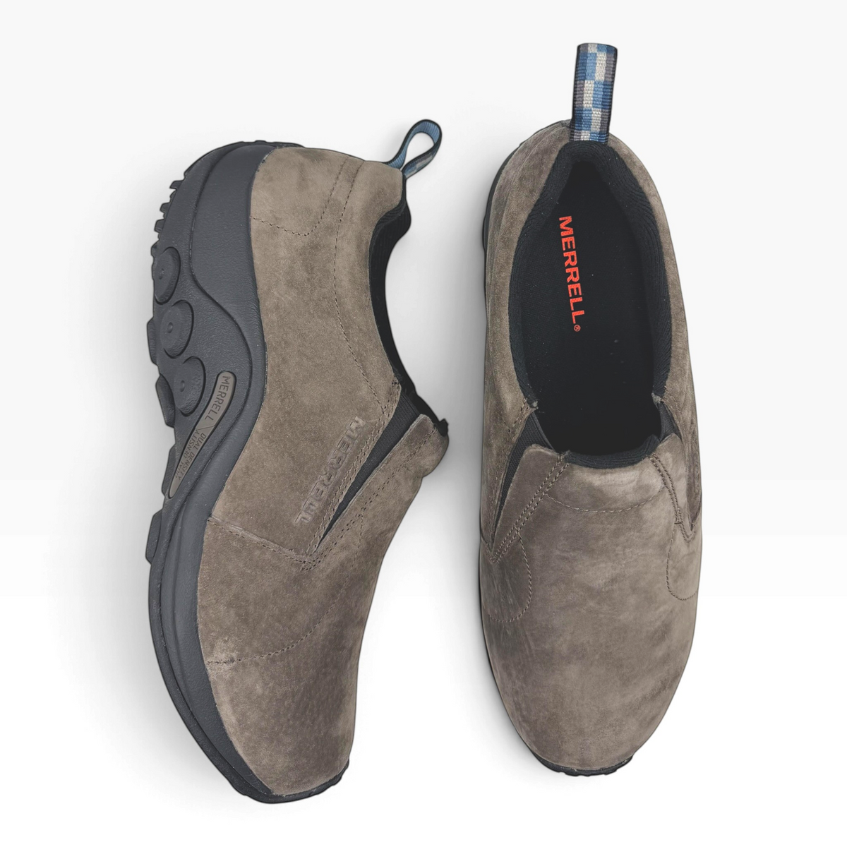 The Shoe Shop Jungle Moc slip-on shoes in fudge brown suede with black rubber outsoles and heel pull tabs