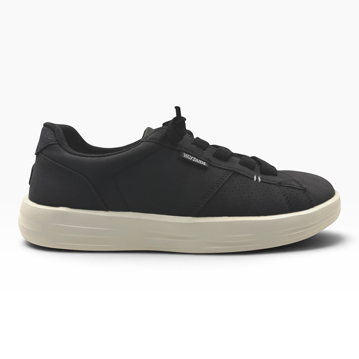 The Shoe Shop Karina Duo Classic black sneakers with a perforated side panel and a thick beige rubber sole.