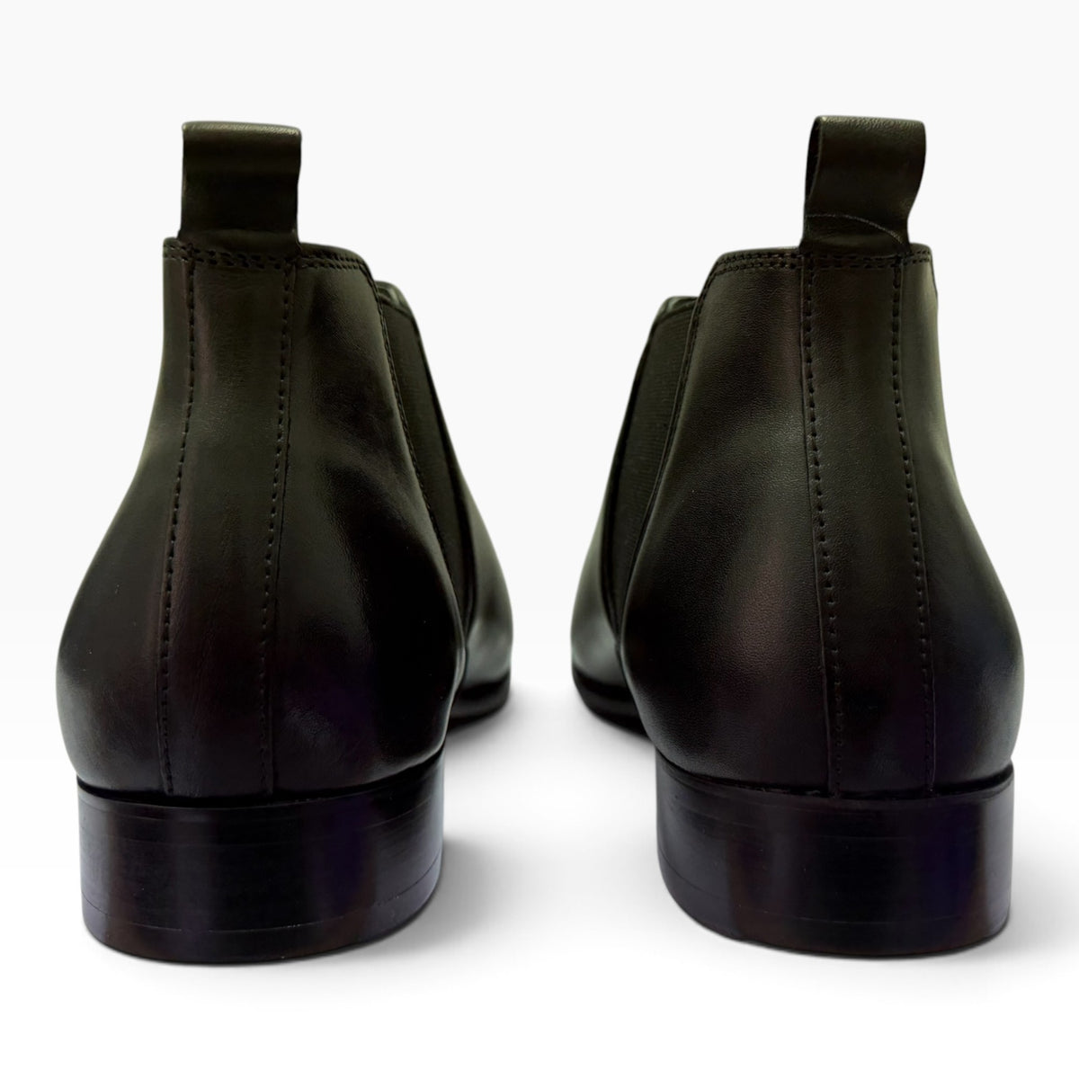 The Shoe Shop Julius Marlow Kick Boot in cognac leather, featuring a rear view with heel pull tabs and rubber soles.