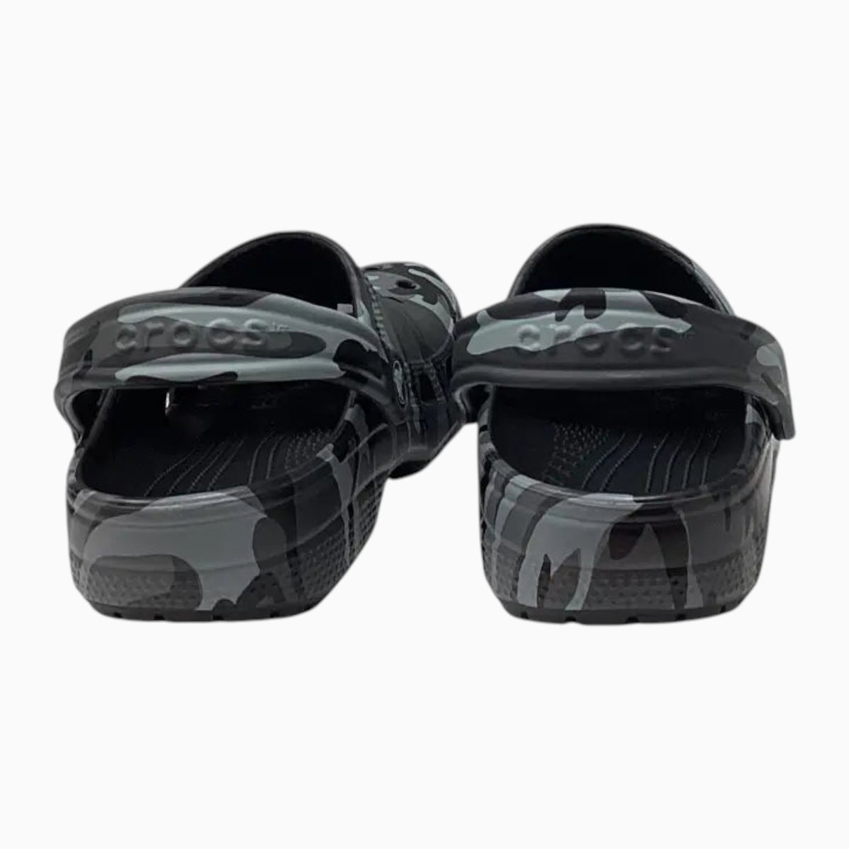 The Shoe Shop kids Crocs Classic Clogs in a grey and black camo print with pivoting heel straps, rear view.