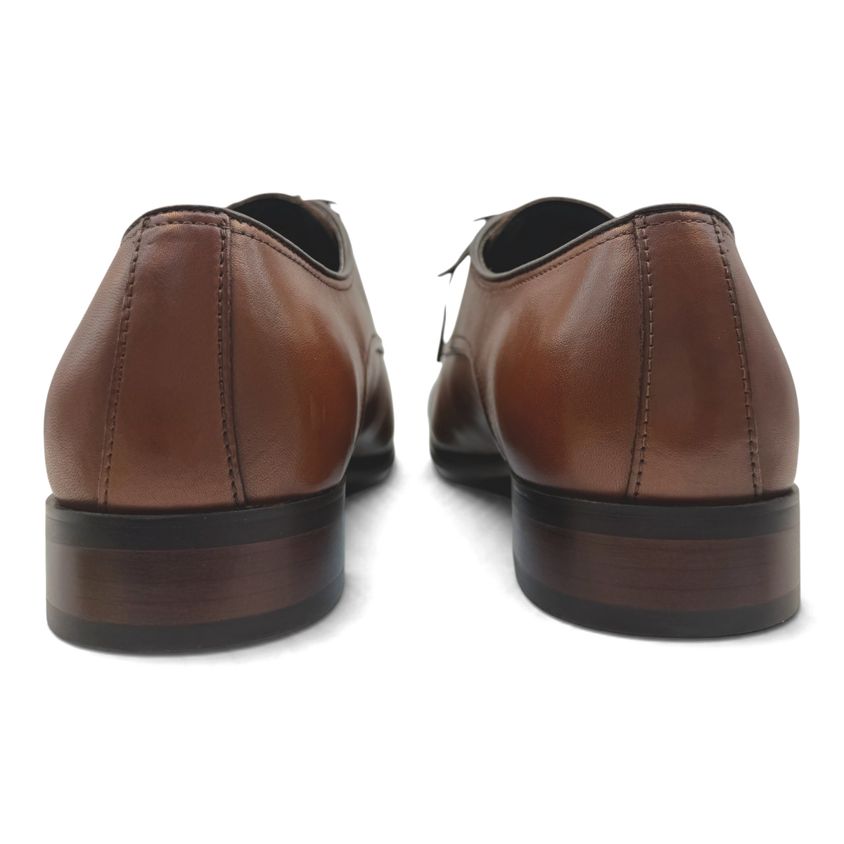 Back view of The Shoe Shop Knock cognac brown leather dress shoes with stacked heels