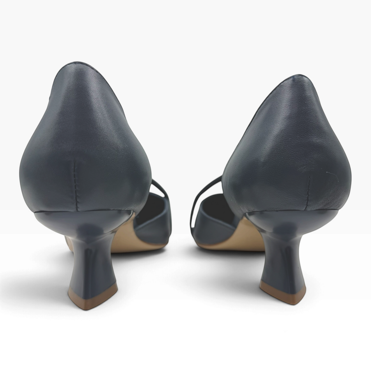 The Shoe Shop Laidy navy blue leather pumps featuring a unique sculpted kitten heel viewed from the back