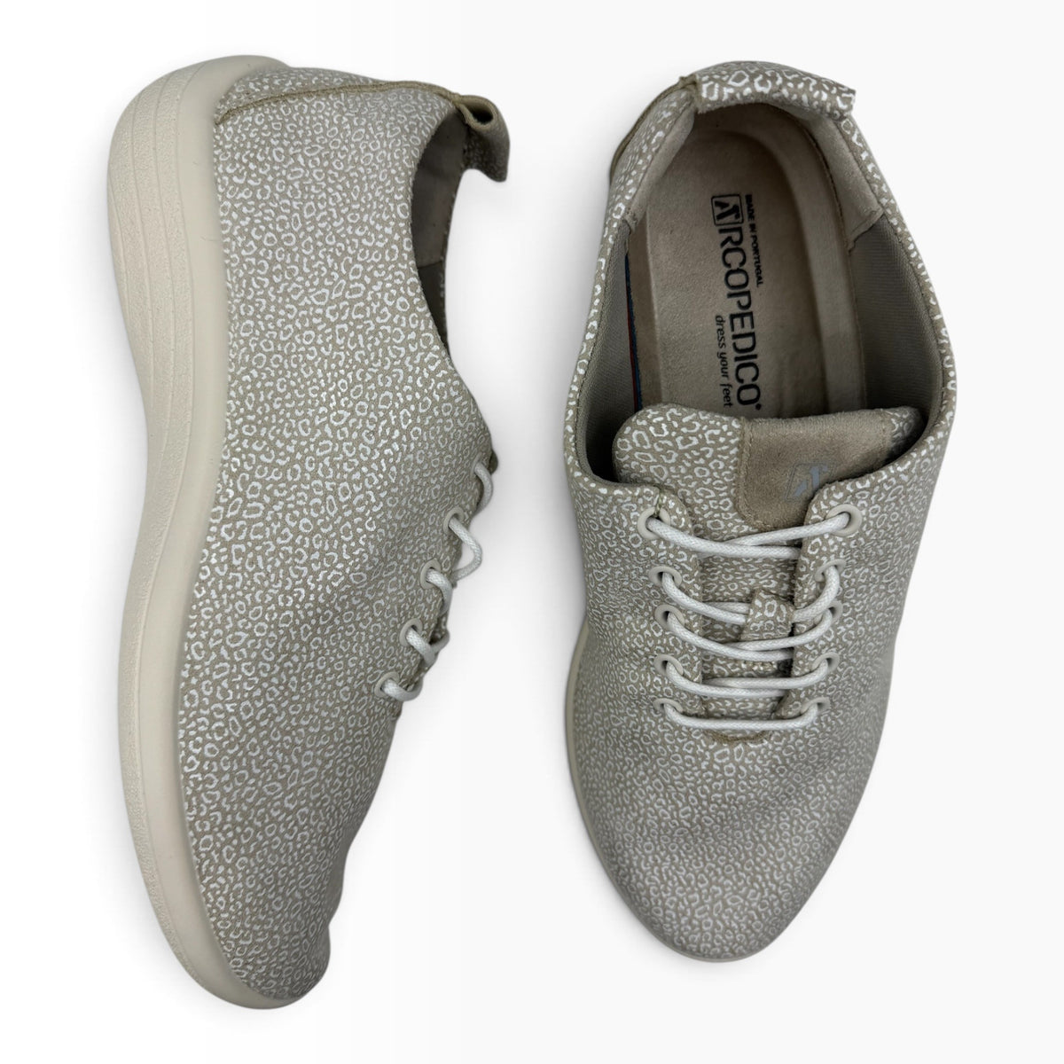 The Shoe Shop Lanin casual flat shoes in beige with a subtle white animal print pattern and white lace-up closure.