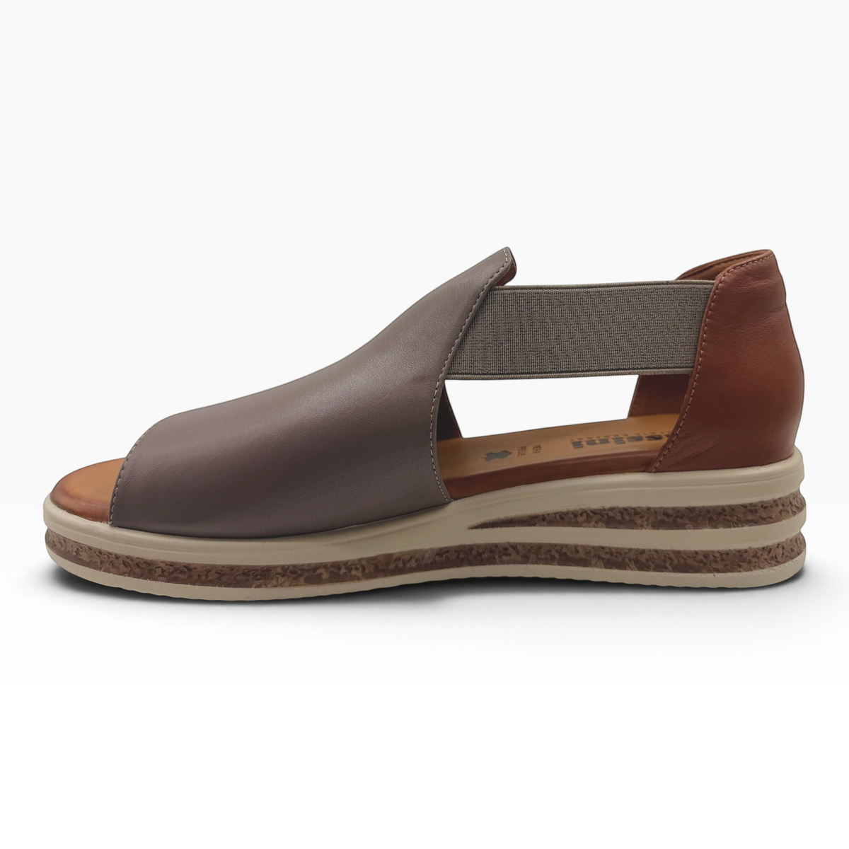 The Shoe Shop Machu leather open-toe wedge sandal in brown with elastic side panel and cork-textured platform sole.