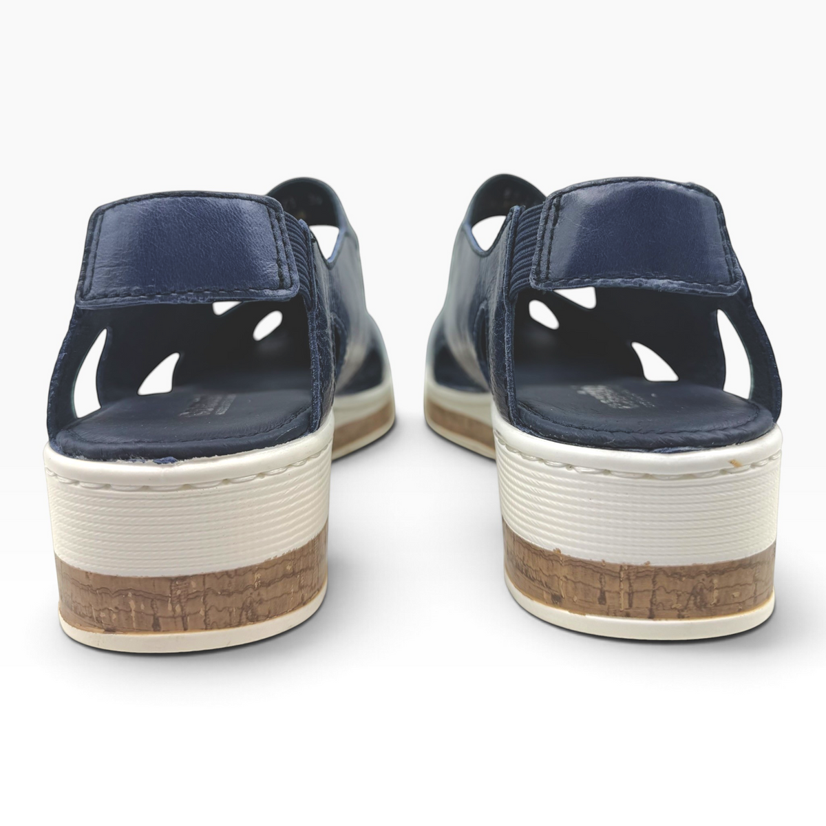 The Shoe Shop Maizy leather sandals in navy blue with a cushioned wedge heel and cork-effect midsole, back view.