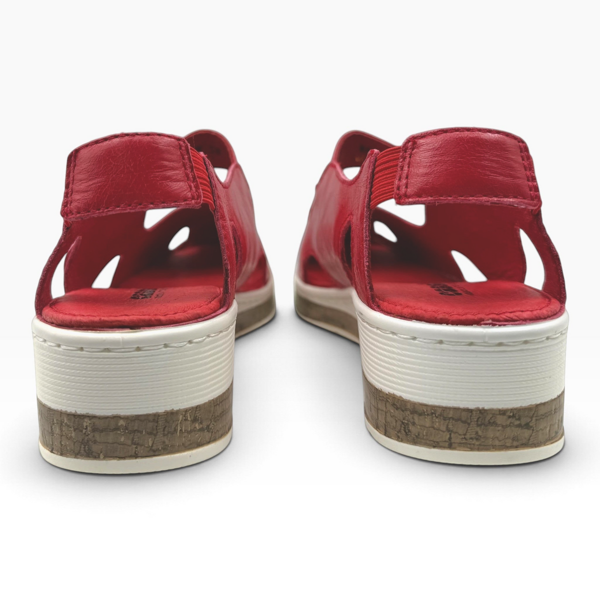 The Shoe Shop Maizy red leather sandals featuring a cushioned footbed, low wedge, and cork-effect midsole, back view.
