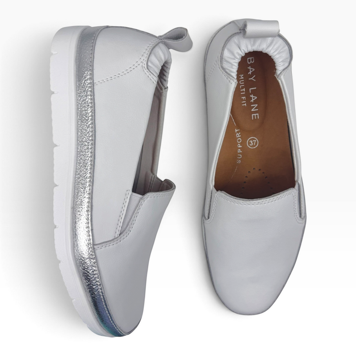 The Shoe Shop Melt slip-on shoes in light grey leather with metallic silver side panels and cushioned insoles.