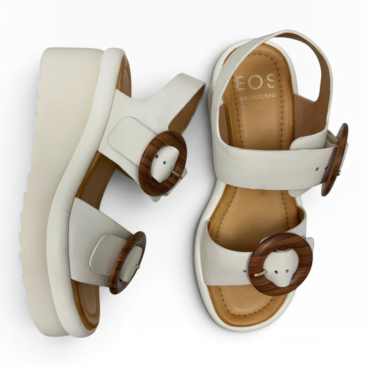 The Shoe Shop Menorcas platform sandals in desert brown leather with wooden buckle details and white soles.