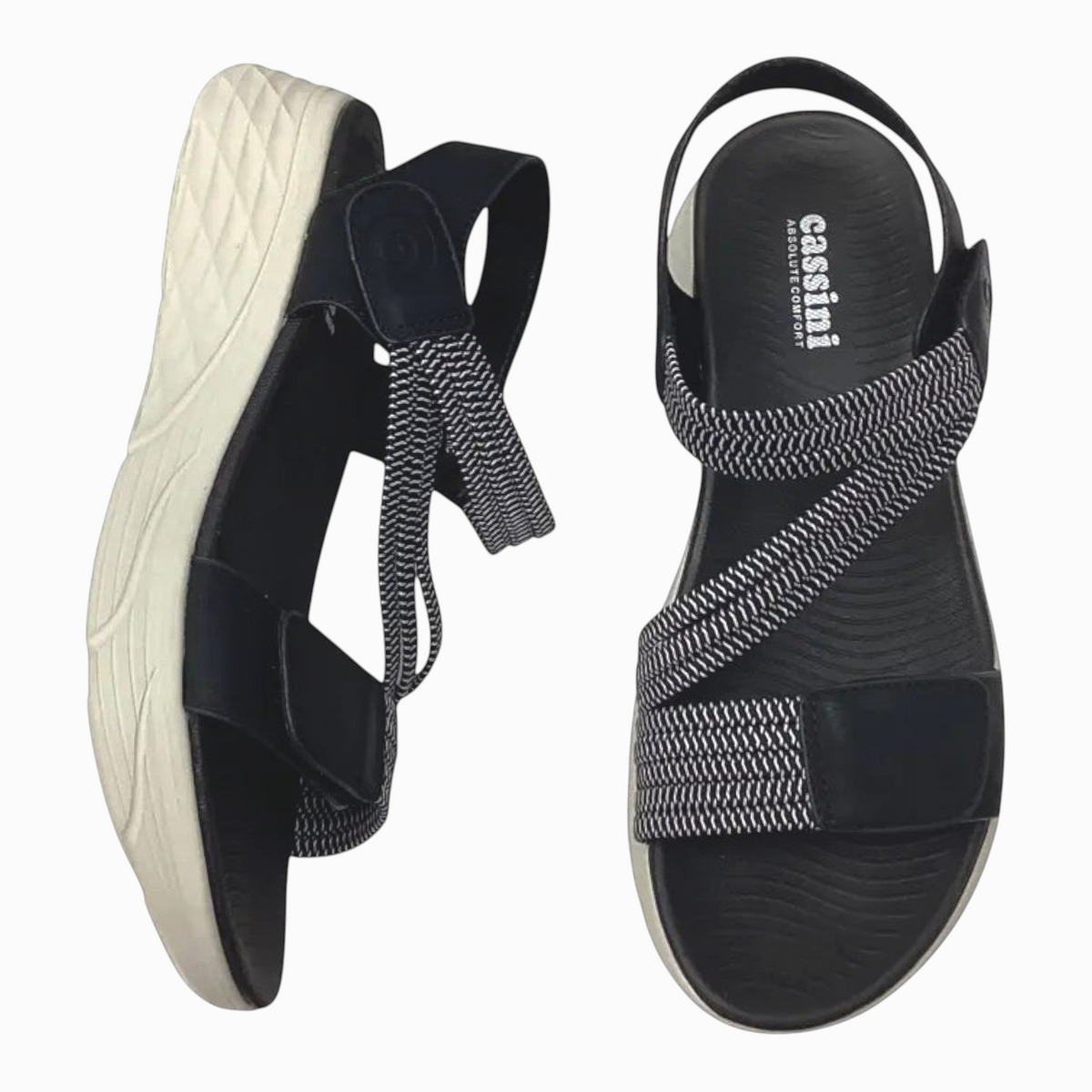 The Shoe Shop Menova black and white elastic strap sandals with lightweight EVA moulded soles and Velcro fasteners.