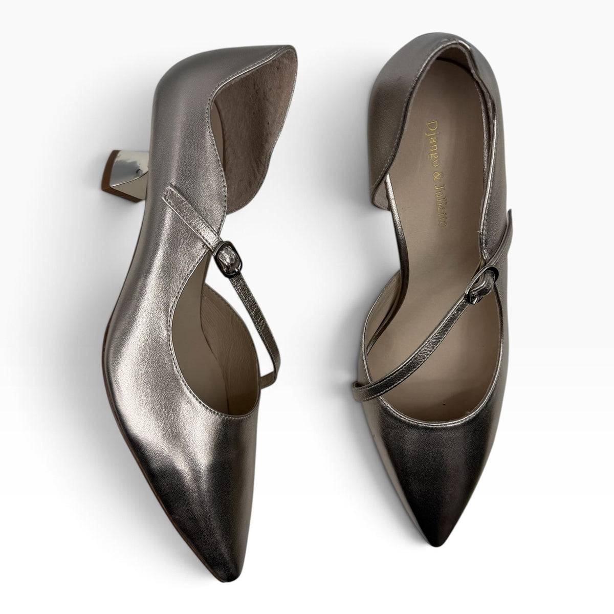The Shoe Shop Laidy pump heels in metallic silver leather with a pointed toe, t-strap, and low block heel.