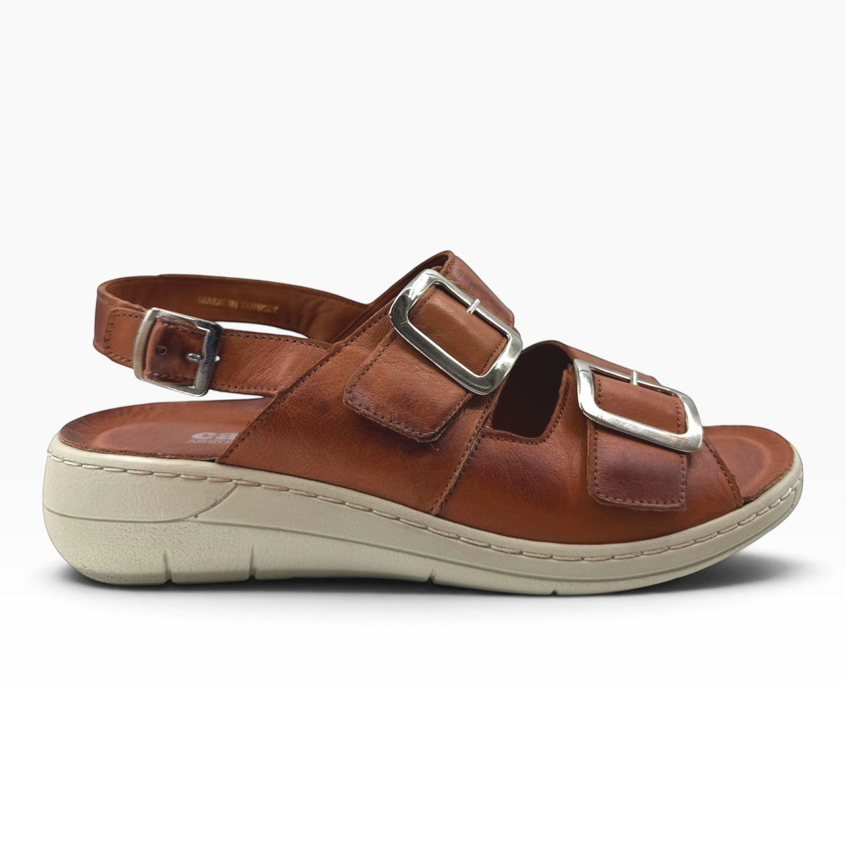 The Shoe Shop Midge brown leather sandal with adjustable silver buckles and a comfortable beige wedge sole